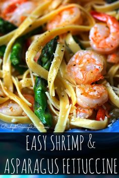 shrimp and asparagus fettuccine in a blue bowl with text overlay