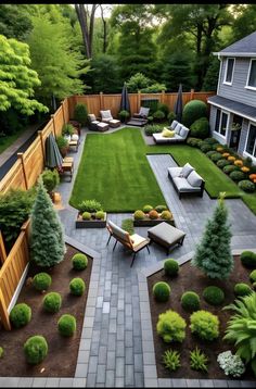 an aerial view of a backyard with seating and landscaping