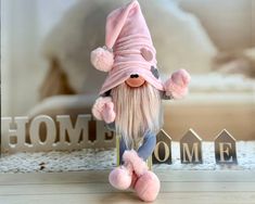 a stuffed animal wearing a pink hat and jeans