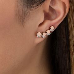 Creative and clever, these lunar crawler earrings make any day magical. Crafted in sterling silver with 14K rose gold plate, each whimsical earring features a curved quartet of sculpted circles - each adorned with four petite lab-created shimmering white sapphires in crescent moon-shaped frames. Buffed to a brilliant luster, these earrings secure with long wire backs that stabilize the climbing design. Elegant Rose Gold Sterling Silver Cartilage Earrings, Rose Gold Cartilage Drop Earrings, Rose Gold Ear Climbers With Ear Wire As Gift, Rose Gold Ear Climbers As Gift, Rose Gold Sterling Silver Single Ear Cuff, Dainty Rose Gold Sterling Silver Ear Climbers, Rose Gold Round Cartilage Earrings With Matching Pair, Rose Gold Round Cartilage Earrings, Elegant Rose Gold Sterling Silver Ear Climbers