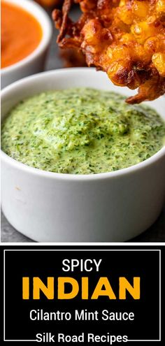 a bowl filled with guacamole and sauce next to other bowls of food