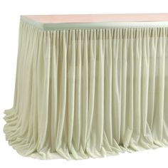 a white table with pleated drapes on it