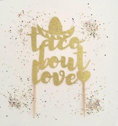 a cake topper that says taco don't love with confetti sprinkles around it