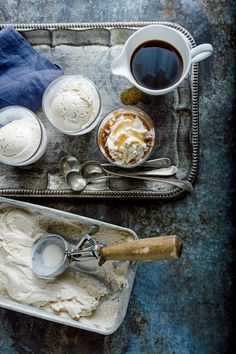 ice cream and coffee are sitting on a tray