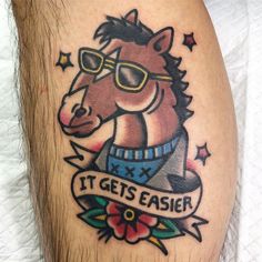 a man's leg with a tattoo on it that says, it gets easier