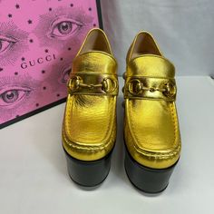 Never Worn.Due To Being On Display This Item May Have A Few Minor Scuffs. To Prevent Any Illegal Returns There Is A Line Through The Designer Name. Luxury Gold Slip-on Heels, Gucci Leather Sole Evening Loafers, Gucci Evening Loafers With Leather Sole, Luxury High Heel Loafers For Evening, Gold Slip-on Loafers For Evening, Gold Calf Leather Loafers With Leather Sole, Gold Loafers With Leather Sole And Calf Leather, Luxury Pointed Toe Platform Loafers For Formal Occasions, Luxury Platform Slip-on Heels