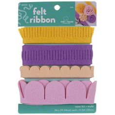 five pieces of felt ribbon in pink, yellow and purple colors on top of each other