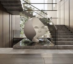 an artistic sculpture in the middle of a room with stairs leading up to it's entrance