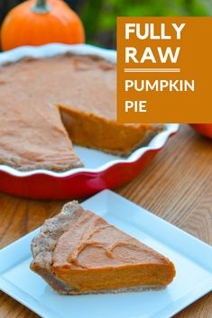 a slice of pumpkin pie on a plate with the rest of the pie in the background