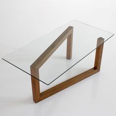 a glass and wood table on a white background