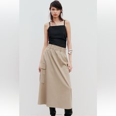 Long Skirt With Elastic Waist And Ruching. Side Patch Pockets With Flaps.Mid-Camel. Brand New With Tags. Full Waist 28” And Beyond . Full Hip 48” ,Length 35” Casual Beige Cargo Skirt For Work, Chic High Waist Khaki Skirt, Casual Khaki Maxi Skirt For Spring, Casual Neutral Flowy Skirt, Fall Long Khaki Skirt, Chic Long Cargo Skirt For Spring, Casual Neutral Midi Skirt, High Waist Beige Maxi Skirt For Work, Beige High Waist Maxi Skirt For Work