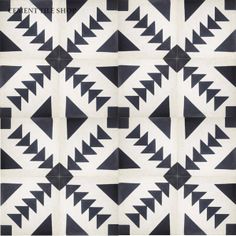 a black and white pattern with arrows on the bottom, in different directions to make it look