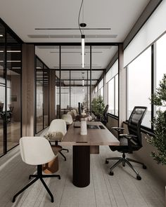 an empty conference room with chairs, desks and plants in the windows on either side