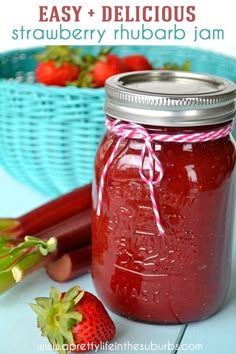 a jar of strawberry jam next to some strawberries