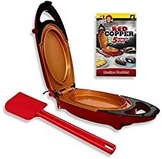 an egg cooker with tongs and red copper frying pan next to it