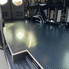 the inside of a vehicle with metal flooring