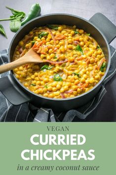 vegan curryed chickpeas in a creamy coconut sauce with spinach leaves