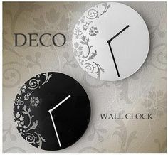 two clocks on the wall with floral designs