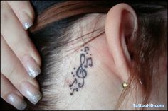 a woman with a music note behind her ear