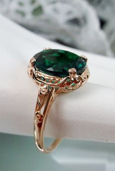 "Natural Treated Green Emerald Ring Edward Design#70z (smaller version) Rose Gold plated Sterling Silver Custom Made Inspired by Edwardian jewelry of the early 1900s, I now offer this lovely Antique reproduction ring in sterling silver rose gold plated. This gorgeous ring is set with a stunning approximately 3.6ct genuine Green Emerald gemstone (Color/Heat treated for clarity and saturation). (VS to Si1 clarity) The oval cut Emerald is 12mm (9/16th of an inch) Long by 10mm Wide (3/8th\"). The ri Antique Emerald Ring Gold, Vintage Emerald Rings Gold, Emerald Ring Oval, Instagram Abbreviations, Vintage Emerald Rings, Antique Emerald Engagement Ring, Emerald Ring Design, Oval Emerald Ring, Rose Gold Emerald Ring