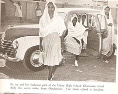 two women standing next to a car with the caption in english and arabic on it