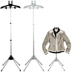 two clothes racks with jackets on them