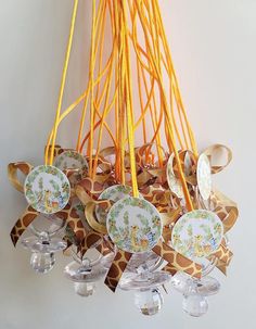 a giraffe print chandelier with plates and cups hanging from the ceiling