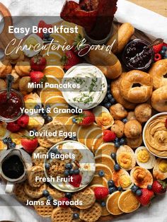 an assortment of breakfast foods arranged on a platter with the words easy breakfast ultimate board