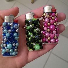 there are three lighters made out of beads