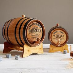 three wooden barrels sitting on top of a table