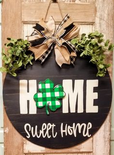 a wooden sign that says home sweet home with a shamrock on it and the words home