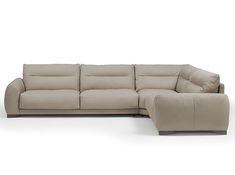 a large sectional couch sitting on top of a white floor