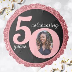 a pink and black circle with the number 50 celebrating years on it is surrounded by confetti