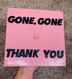 someone holding up a pink sign that says,'gone, gone thank you '