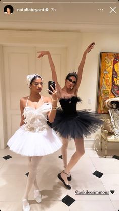 two ballerinas in tutus taking a selfie