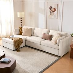 a living room filled with furniture and a large rug