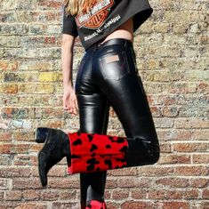 Look No Further Than These Rare Vintage Wrangler Black Faux Leather Pants With A Red Embroidered Design And Silver Rivets On The Upper Thighs. The Bottom Of The Pant Legs Are Adorned With A Unique Red And Black Velvet Cow Print. Waist: 30” Inseam: 30" #Wranglerpants #Blackfauxleather #Redembroidery #Silverrivets #Velvetcowprint #90sfashionrevival Edgy Fitted Winter Jeans, Fitted Red Bottoms For Winter, Fitted Wide Leg Leather Pants For Winter, Mid-rise Bottoms For Fall Rodeo, Trendy Fitted Pants With Standard Cut Leg, Winter Fitted Leather Pants Straight Leg, Fitted Straight Leg Leather Pants For Winter, Western Style Fitted Full-length Jeans, Fitted Full-length Western Jeans