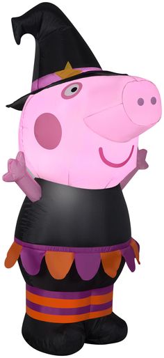 an inflatable pig with a witches hat