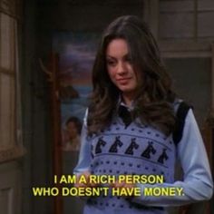 a woman in a blue and white sweater with the words, i am a rich person who doesn't have money