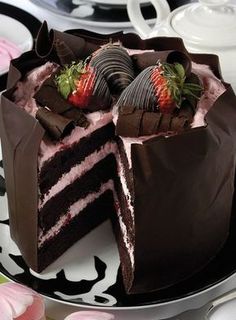 a chocolate cake with strawberries on top