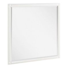 a white framed mirror on a wall with no glass in the front and bottom corner