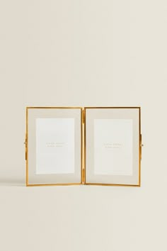 an open book with two pages on the front and one in the back, sitting against a white background