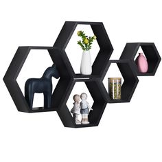 PRICES MAY VARY. 5 MULTIPLE SIZE SHELVES - hexagon floating shelves are large in size, so will look great as wall decor for living room, bedroom, bathroom,kitchen in home office and even nursery. A combination of these storage shelves on the wall adds a charming appearance STURDY SHELF-Decorate your home with the beautiful, premium quality wood hexagon shelf. These solid timber hexagon shelves for wall are strong, sturdy and lightweight. Hold all your precious collectibles, books, or plants with Honeycomb Shelves Decor, Hexagon Floating Shelves, Hexagon Wall Shelf, Wood Hexagon, Honeycomb Shelves, Bracket Shelf, Wall Decor Storage, Hexagon Shelves, Driftwood Finish