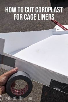 someone is holding up a cardboard box with tape on it and the words how to cut copplast for cage liners