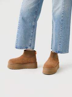 DESCRIPTION:A fashionable boot made from soft suede and finished with a soft UGGplush™ interior and a platform sole.FEATURES:Round ToeBack Pull TabSuede Upper17mm UGGplush™ Lining & InsoleFoam FootbedEVA Midsole & OutsolePlatform Height: 2 in. Ugg Platform, Polo Shoes, Snowboard Shop, Ugg Mini, Ugg Classic Mini, Denim Sweater, Ugg Classic, Fashion Baby, Saint Bernard