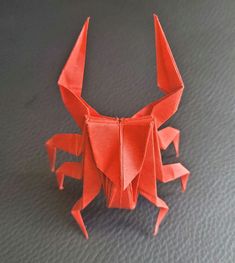 an origami crab is on the table