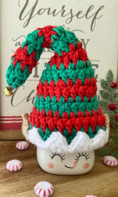 a crocheted elf hat sitting on top of a table