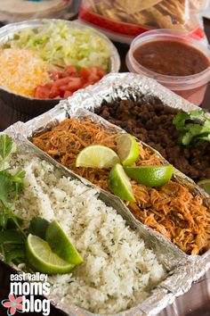 mexican food is served in tin foil containers