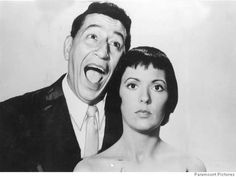 an old black and white photo of a man and woman with their mouths wide open