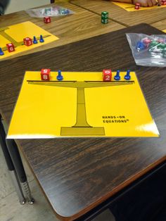 the board game hands - on is being played by two children at a table with dices